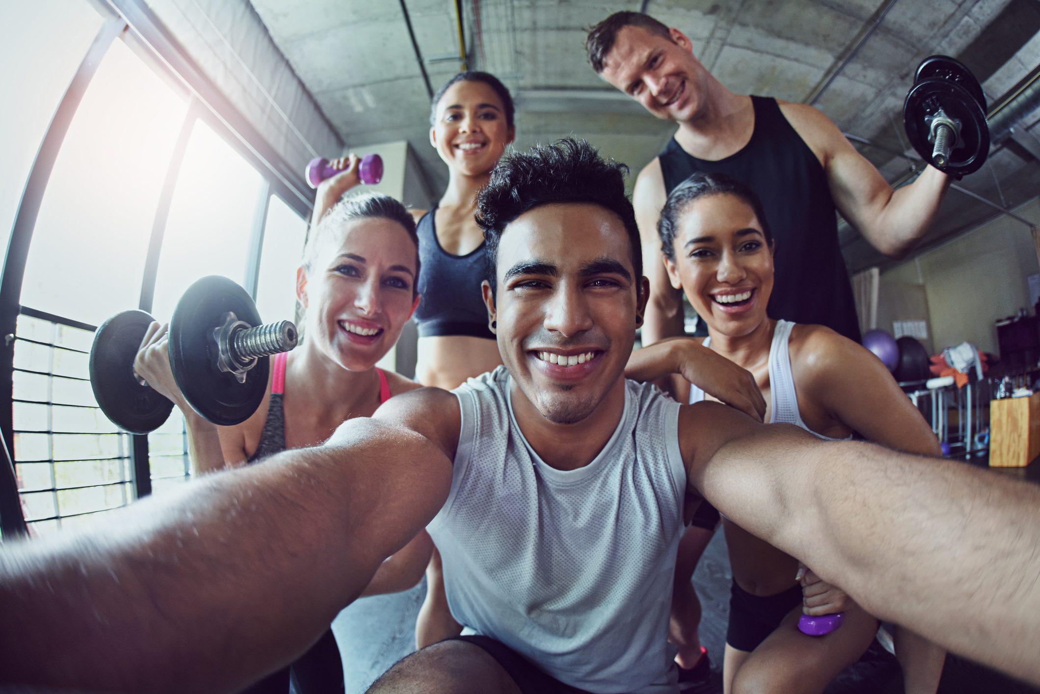 Personal trainer with clients taking a selfie